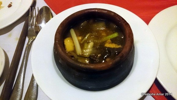 Tofu curry with mushrooms, eggplant in a clay pot